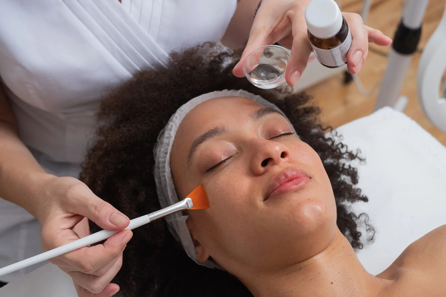 A PCA facial peel applied with a brush.
