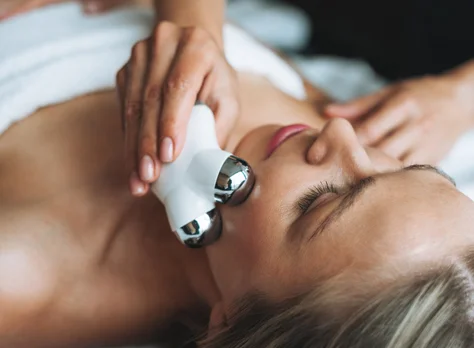A microcurrent facial device applied along the cheek.